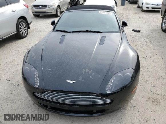 2009 Aston Martin Vantage z VIN SCFBF04CX9GD11942, wystawiony jako Copart lot #43771214 z przebiegiem 52 730 mil mil oraz . Historia ofert i sprzedaży dostępna na DreamBid. Obrazek 5.