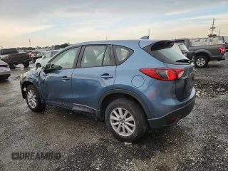 2015 Mazda CX-5 Sport with VIN JM3KE2BE3F0488309, listed as a Copart auction lot 63688835 with 121,775 mi miles and Clean title. Bid and sale history available at DreamBid. Image 2.