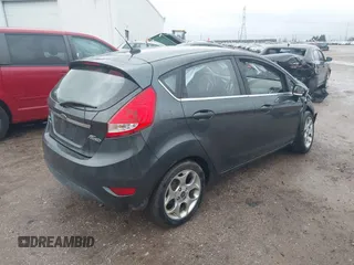 2011 Ford Fiesta SES with VIN 3FADP4FJ7BM111381, listed as a IAAI auction lot 41226251 with 93,694 mi miles. Bid and sale history available at carsss.com. Image 4.
