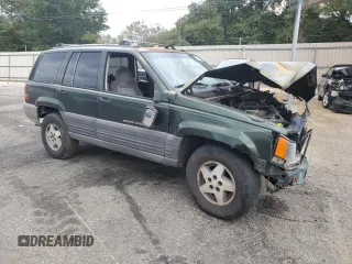 1995 Jeep Grand Cherokee Laredo with VIN 1J4FX58S0SC726476, listed as a Copart auction lot 69608784 with 264,705 mi miles and Salvage Title. Bid and sale history available at carsss.com. Image 4.