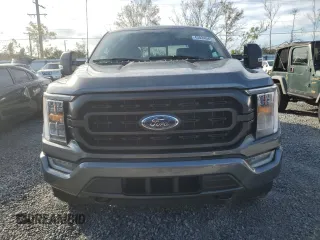 2023 Ford F-150 XL with VIN 1FTEW1EP4PFB38678, listed as a Copart auction lot 43024045 with 8,718 mi miles and Salvage title. Bid and sale history available at DreamBid. Image 5.