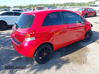 2009 Toyota Yaris with VIN JTDJT903695234623, listed as a IAAI auction lot 42027852 with 146,000 mi miles. Bid and sale history available at carsss.com. Image 4.