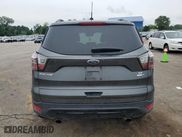 2017 Ford Escape SE z VIN 1FMCU9GD1HUB35003, wystawiony jako Copart lot #56502385 z przebiegiem 74 409 mil mil oraz Szkoda całkowita • Salvage title. Historia ofert i sprzedaży dostępna na DreamBid. Obrazek 6.