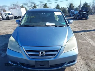 2005 Honda Odyssey EX-L with VIN 5FNRL38765B076591, listed as a IAAI auction lot 41624354 with 172,698 mi miles and . Bid and sale history available at DreamBid. Image 11.