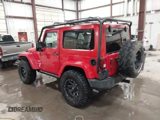 2011 Jeep Wrangler Sahara with VIN 1J4AA5D10BL593534, listed as a IAAI auction lot 41551416 with 101,716 mi miles and . Bid and sale history available at DreamBid. Image 3.
