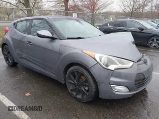 2017 Hyundai Veloster with VIN KMHTC6AD4HU309625, listed as a IAAI auction lot 41933497 with 184,632 mi miles. Bid and sale history available at carsss.com. Image 1.