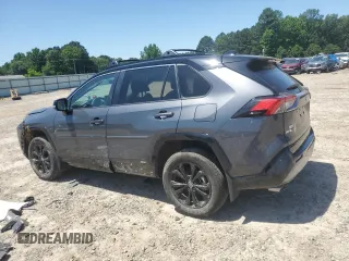 2023 Toyota RAV4 Hybrid XSE with VIN 2T3E6RFV9PW039963, listed as a Copart auction lot 57594335 with 27,486 mi miles and Salvage title. Bid and sale history available at DreamBid. Image 2.