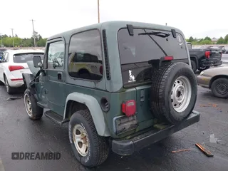 1999 Jeep Wrangler Sport with VIN 1J4FY19S6XP428003, listed as a IAAI auction lot 42149234 with 1 mi miles. Bid and sale history available at carsss.com. Image 3.