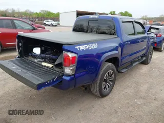 2023 Toyota Tacoma SR z VIN 3TMCZ5AN1PM589061, wystawiony jako IAAI lot #41936717 z przebiegiem 41 395 mil mil oraz . Historia ofert i sprzedaży dostępna na DreamBid. Obrazek 4.