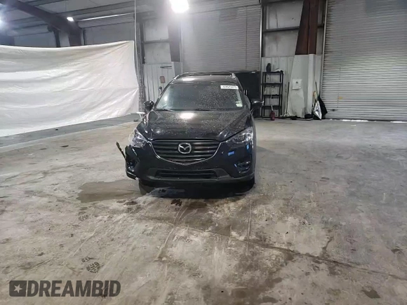 2016 Mazda CX-5 Grand Touring with VIN JM3KE4DY6G0655802, listed as a Copart auction lot 43820475 with 76,639 mi miles and Salvage Title. Bid and sale history available at carsss.com. Image 12.