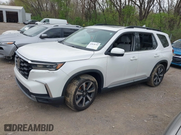 2023 Honda Pilot Elite with VIN 5FNYG1H80PB020937, listed as a IAAI auction lot 42024743 with 20,740 mi miles and . Bid and sale history available at DreamBid. Image 2.