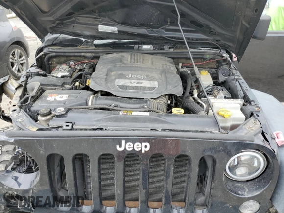 2015 Jeep Wrangler Unlimited Willys Wheeler with VIN 1C4BJWDG3FL601197, listed as a Copart auction lot 53832465 with 216,141 mi miles and Salvage Title. Bid and sale history available at DreamBid. Image 12.