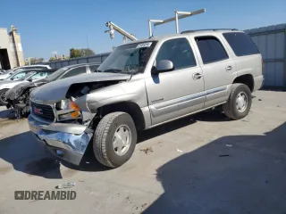 2005 GMC Yukon SLE with VIN 1GKEC13T95J221417, listed as a Copart auction lot 77009394 with 308,033 mi miles and Salvage Title. Bid and sale history available at carsss.com. Image 1.
