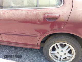 1999 Nissan Sentra XE with VIN 3N1AB41D0XL107458, listed as a IAAI auction lot 42536232 with 119,701 mi miles and . Bid and sale history available at DreamBid. Image 15.