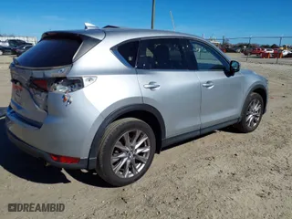 2020 Mazda CX-5 Grand Touring with VIN JM3KFADM7L0731479, listed as a IAAI auction lot 41697226 with 90,517 mi miles. Bid and sale history available at carsss.com. Image 4.