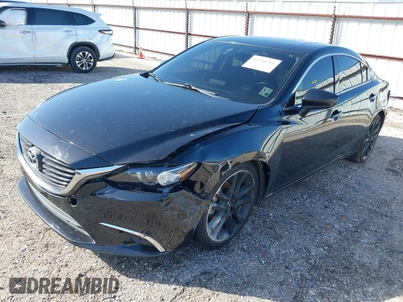 2016 Mazda 6 i Grand Touring with VIN JM1GJ1W50G1478699, listed as a IAAI auction lot 41711211 with 208,720 mi miles and . Bid and sale history available at DreamBid. Image 2.