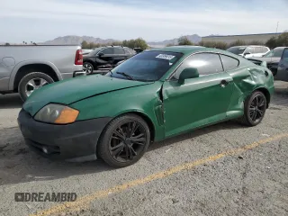 2004 Hyundai Tiburon GT z VIN KMHHN65F74U129996, wystawiony jako Copart lot #43359015 z przebiegiem 231 277 mil mil oraz Szkoda całkowita • Salvage title. Historia ofert i sprzedaży dostępna na DreamBid. Obrazek 1.