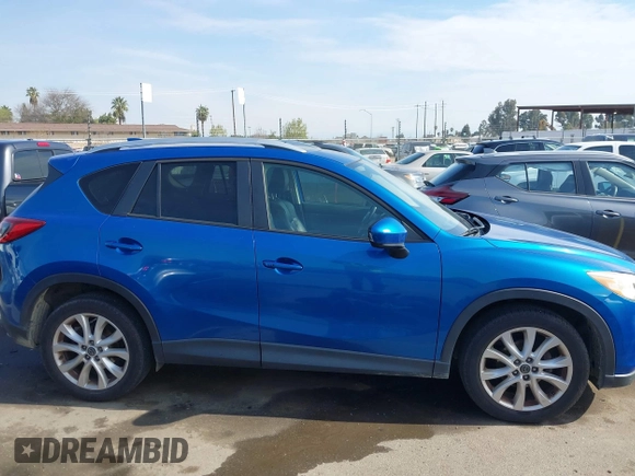 2014 Mazda CX-5 Grand Touring with VIN JM3KE4DY1E0327703, listed as a IAAI auction lot 41755735 with 206,845 mi miles. Bid and sale history available at carsss.com. Image 13.