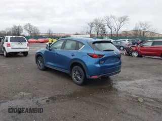 2019 Mazda CX-5 Sport with VIN JM3KFBBM5K0668678, listed as a IAAI auction lot 41811146 with 102,634 mi miles and . Bid and sale history available at DreamBid. Image 3.