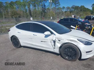 2019 Tesla Model 3 Mid Range with VIN 5YJ3E1EA7KF425127, listed as a IAAI auction lot 41886436 with 87,236 mi miles. Bid and sale history available at carsss.com. Image 1.