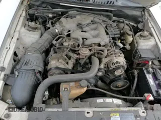 2004 Ford Mustang Deluxe with VIN 1FAFP44454F123067, listed as a Copart auction lot 86784474 with 161,541 mi miles and Salvage title. Bid and sale history available at DreamBid. Image 13.