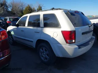 2009 Jeep Grand Cherokee Laredo with VIN 1J8GS48K29C518895, listed as a IAAI auction lot 41161045 with 153,499 mi miles. Bid and sale history available at carsss.com. Image 3.