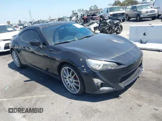 2014 Scion FR-S z VIN JF1ZNAA10E9706819, wystawiony jako IAAI lot #42320526 z przebiegiem 104 784 mil mil oraz . Historia ofert i sprzedaży dostępna na DreamBid. Obrazek 1.