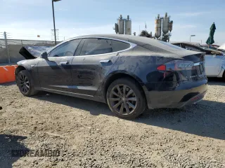 2014 Tesla Model S 60 with VIN 5YJSA1H13EFP38425, listed as a Copart auction lot 63686205 with 183,968 mi miles and Salvage title. Bid and sale history available at DreamBid. Image 2.