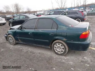 1999 Honda Civic VP with VIN 2HGEJ6617XH537283, listed as a IAAI auction lot 41483084 with 153,655 mi miles. Bid and sale history available at carsss.com. Image 14.