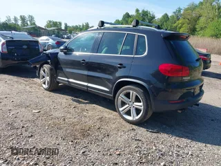 2014 Volkswagen Tiguan S z VIN WVGBV3AX5EW560393, wystawiony jako IAAI lot #42105203 z przebiegiem 102 001 mil mil oraz . Historia ofert i sprzedaży dostępna na DreamBid. Obrazek 3.