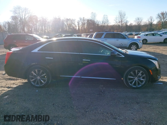 2013 Cadillac XTS z VIN 2G61N5S32D9238652, wystawiony jako IAAI lot #40966692 z przebiegiem 90 834 mil mil oraz . Historia ofert i sprzedaży dostępna na DreamBid. Obrazek 13.