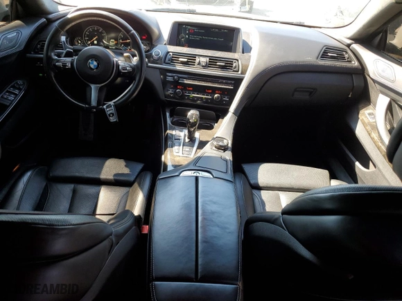 2015 BMW 6 Series 650i xDrive with VIN WBA6B4C57FD761268, listed as a Copart auction lot 49779055 with 106,118 mi miles and Salvage Title. Bid and sale history available at carsss.com. Image 8.