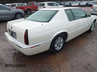 1997 Cadillac Eldorado ESC z VIN 1G6EL12Y6VU614754, wystawiony jako IAAI lot #41543611 z przebiegiem 73 273 mil mil oraz . Historia ofert i sprzedaży dostępna na DreamBid. Obrazek 4.