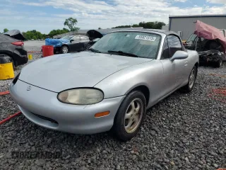 2000 Mazda MX-5 Miata with VIN JM1NB3537Y0142121, listed as a Copart auction lot 55921515 with 126,638 mi miles and Salvage title. Bid and sale history available at DreamBid. Image 1.