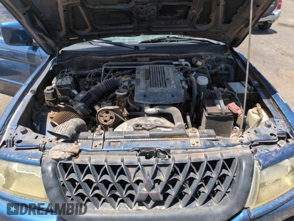 2001 Mitsubishi Montero ES z VIN JA4MT21H81P001568, wystawiony jako Copart lot #57666105 z przebiegiem 203 228 mil mil oraz Szkoda całkowita • Salvage title. Historia ofert i sprzedaży dostępna na DreamBid. Obrazek 11.