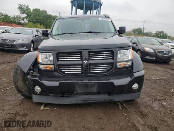 2011 Dodge Nitro Heat with VIN 1D4PT4GK7BW597557, listed as a Copart auction lot 58973335 with 180,958 mi miles and Salvage title. Bid and sale history available at DreamBid. Image 5.