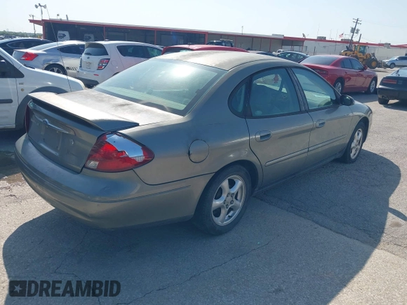 2003 Ford Taurus SE Standard z VIN 1FAFP53UX3A228383, wystawiony jako IAAI lot #42700752 z przebiegiem 182 598 mil mil oraz . Historia ofert i sprzedaży dostępna na DreamBid. Obrazek 4.