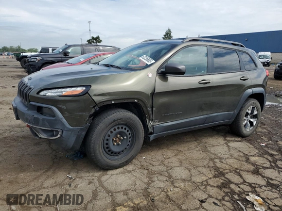 2015 Jeep Cherokee Trailhawk with VIN 1C4PJMBSXFW545534, listed as a Copart auction lot 62236885 with 148,448 mi miles and Clean title. Bid and sale history available at DreamBid. Image 1.