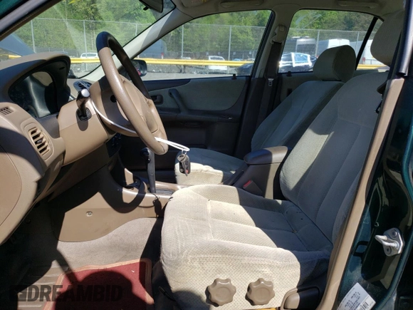 1999 Mazda Protege DX with VIN JM1BJ2223X0139775, listed as a Copart auction lot 54338455 with 63,198 mi miles and Salvage Title. Bid and sale history available at DreamBid. Image 7.