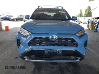 2022 Toyota RAV4 Hybrid SE with VIN 4T3T6RFV7NU103423, listed as a Copart auction lot 59709215 with 27,595 mi miles and Salvage title. Bid and sale history available at DreamBid. Image 5.