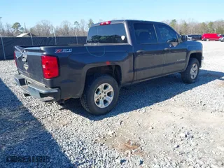 2014 Chevrolet Silverado 1500 LT with VIN 3GCUKREC6EG553001, listed as a IAAI auction lot 41415936 with 254,622 mi miles. Bid and sale history available at carsss.com. Image 4.