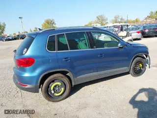 2017 Volkswagen Tiguan Wolfsburg Edition with VIN WVGRV7AX0HW502041, listed as a IAAI auction lot 31232130 with 30,214 mi miles. Bid and sale history available at carsss.com. Image 4.