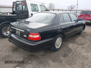 1999 Infiniti Q45 z VIN JNKBY31A3XM602466, wystawiony jako IAAI lot #41721377 z przebiegiem 113 158 mil mil oraz . Historia ofert i sprzedaży dostępna na DreamBid. Obrazek 4.