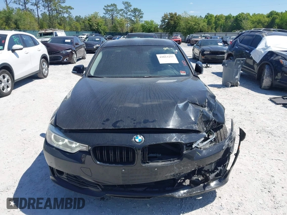 2013 BMW 3 Series 328i with VIN WBA3C1C57DF434854, listed as a IAAI auction lot 42023257 with 125,960 mi miles and . Bid and sale history available at carsss.com. Image 12.