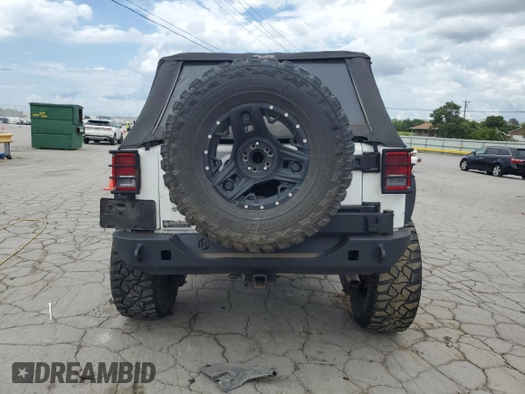 2015 Jeep Wrangler Unlimited Sport с VIN 1C4BJWDG3FL570131, выставлен на аукционе Copart как лот 64418415 с пробегом 112 362 миль миль и Списание • Salvage title. История ставок и продаж доступна на DreamBid. Изображение 6.