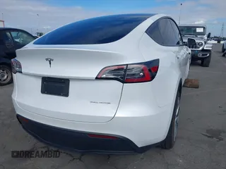 2023 Tesla Model Y Long Range with VIN 7SAYGDEE9PA094191, listed as a IAAI auction lot 41906319 with 15,240 mi miles and . Bid and sale history available at DreamBid. Image 4.