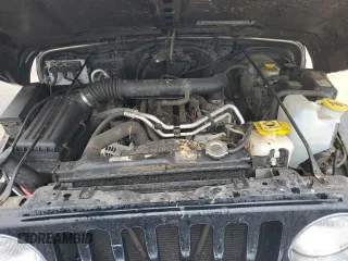 2002 Jeep Wrangler Sahara with VIN 1J4FA59SX2P747327, listed as a Copart auction lot 59515455 with 79,964 mi miles and Salvage title. Bid and sale history available at DreamBid. Image 11.