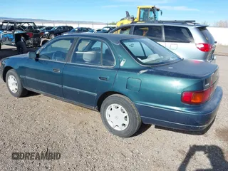 1996 Toyota Camry DX z VIN 4T1BG12K7TU661879, wystawiony jako IAAI lot #42203349 z przebiegiem 213 970 mil mil oraz . Historia ofert i sprzedaży dostępna na DreamBid. Obrazek 3.