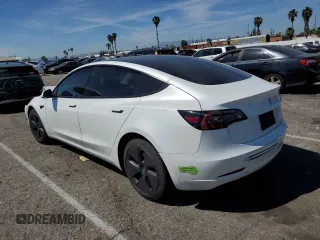 2023 Tesla Model 3 with VIN 5YJ3E1EA9PF401418, listed as a Copart auction lot 50597015 with 79,673 mi miles and Salvage Title. Bid and sale history available at DreamBid. Image 2.