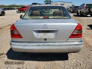 1995 Mercedes-Benz C with VIN WDBHA28E7SF255142, listed as a Copart auction lot 68411704 with 334,000 mi miles and Salvage Title. Bid and sale history available at carsss.com. Image 6.